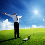 happy young businessman on spring field